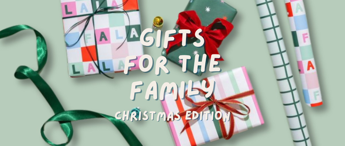 Text: Gifts for the family Christmas Edition. Image: Wrapped Christmas gifts, wrapping paper and ribbon