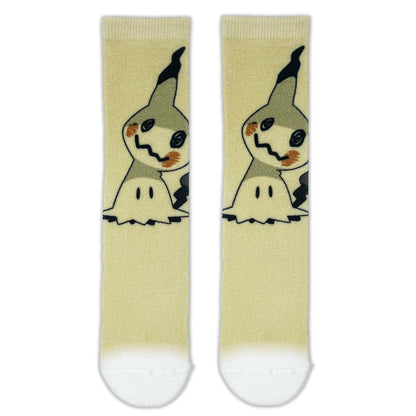 A pair of crew socks with a light yellow body, featuring a printed cartoon character resembling Mimikyu, with white toes and heels.