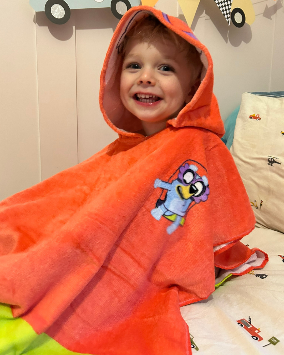 Child wearing Janet (Bluey) poncho