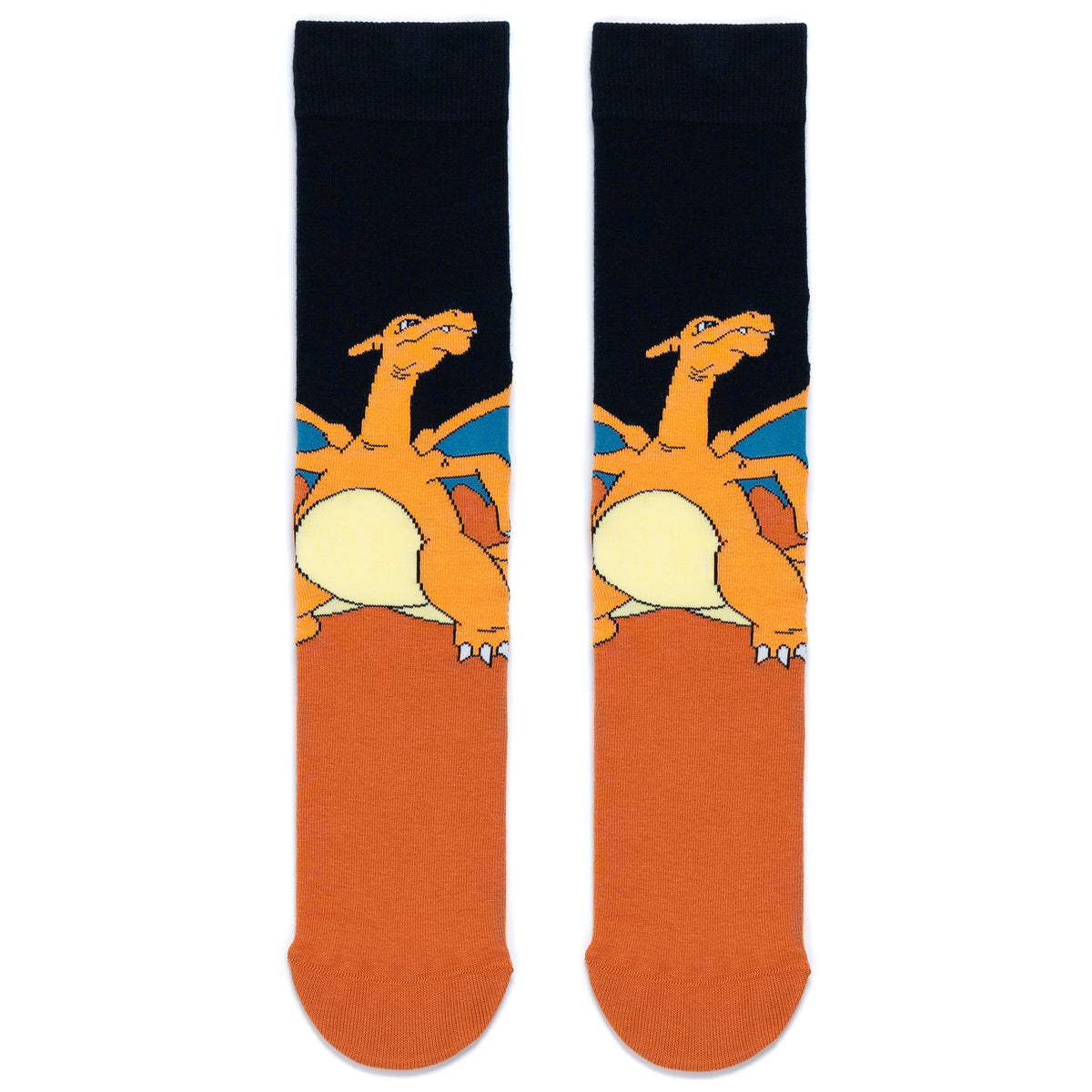 A pair of crew socks laid flat side by side featuring a graphic of the Pokémon Charizard. The upper section is black with Charizard and its blue lined wings, while the lower section and toe area are a solid brown.