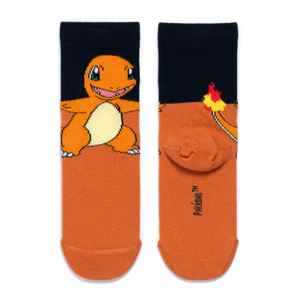A pair of adult sized Charmander socks. Front and back view. Black at the top and orange from half way down and a character model on top.
