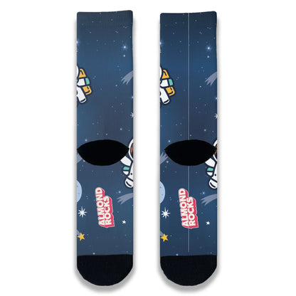 Back view of navy space-themed novelty socks continuing the star and galaxy pattern across the heel and ankle.