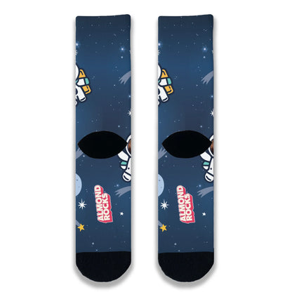 Back view of navy space-themed novelty socks continuing the star and galaxy pattern across the heel and ankle.