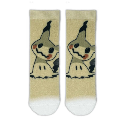 A pair of beige crew socks featuring a Mimikyu on the upper half and white tips at the bottom, shown against a plain white background.
