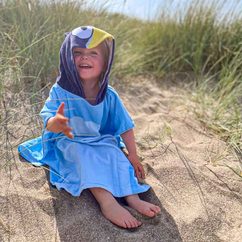 Girl in Bluey Poncho Towel at the Beach
