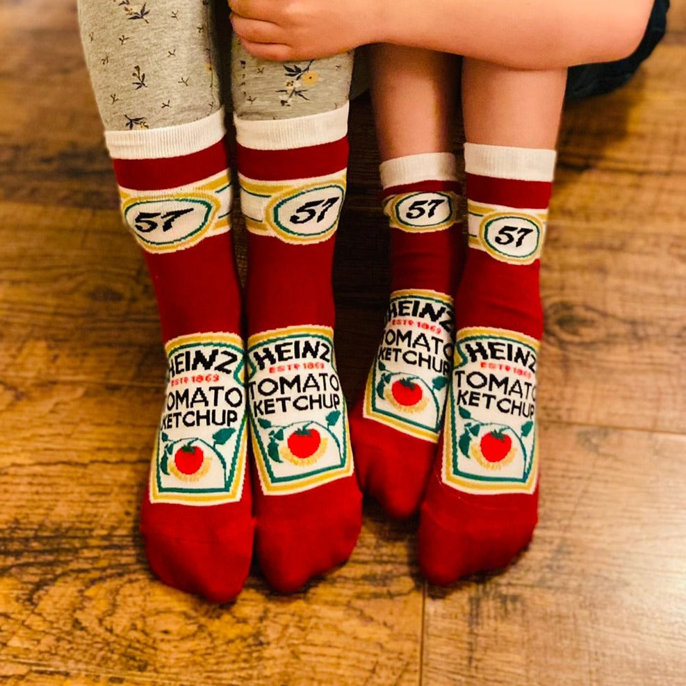Two kids wearing the iconic ketchup 57 embroidered socks