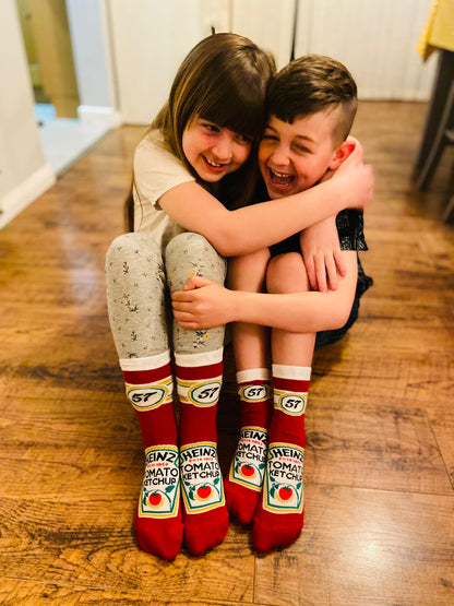 Two kids wearing the iconic ketchup 57 embroidered socks